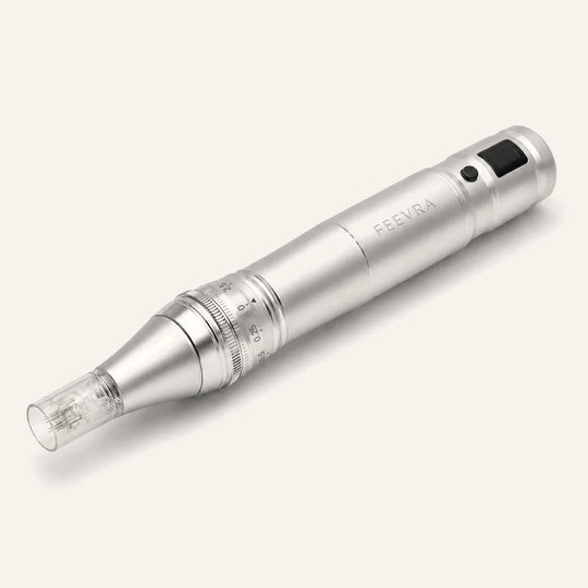 Silver Feevra Microneedling Pen with sterile needle cartridge and LED display, seen at an angle